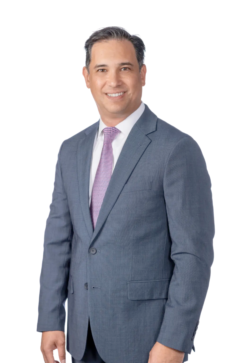 A man in a gray suit with a purple tie smiles at the camera against a plain background.